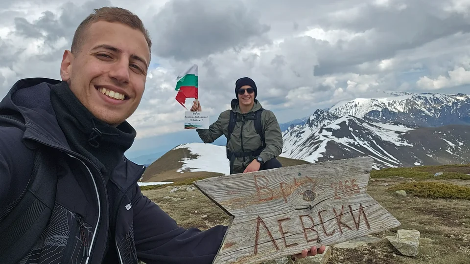 On the peak with the sign