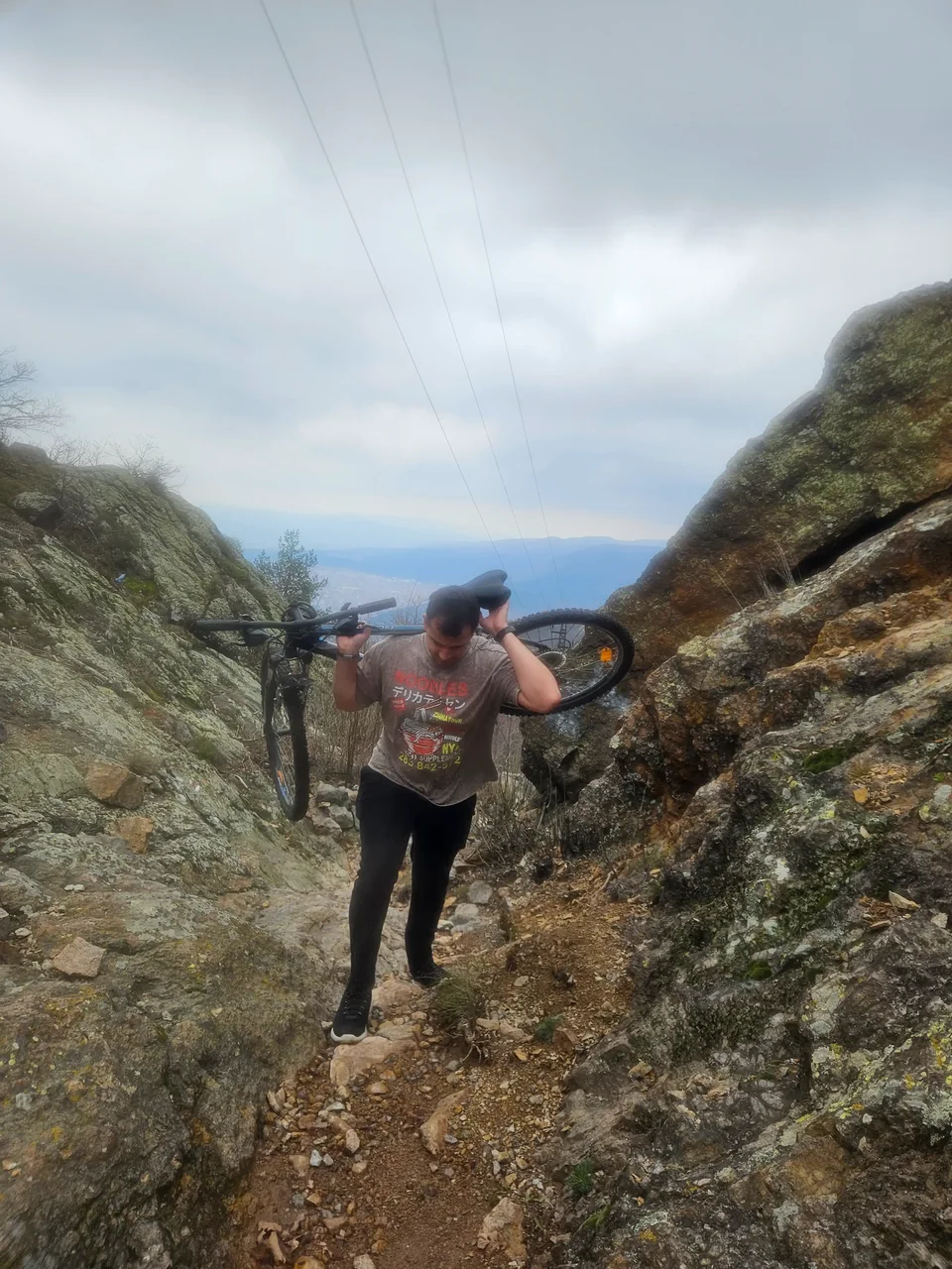Mitko carrying a bike