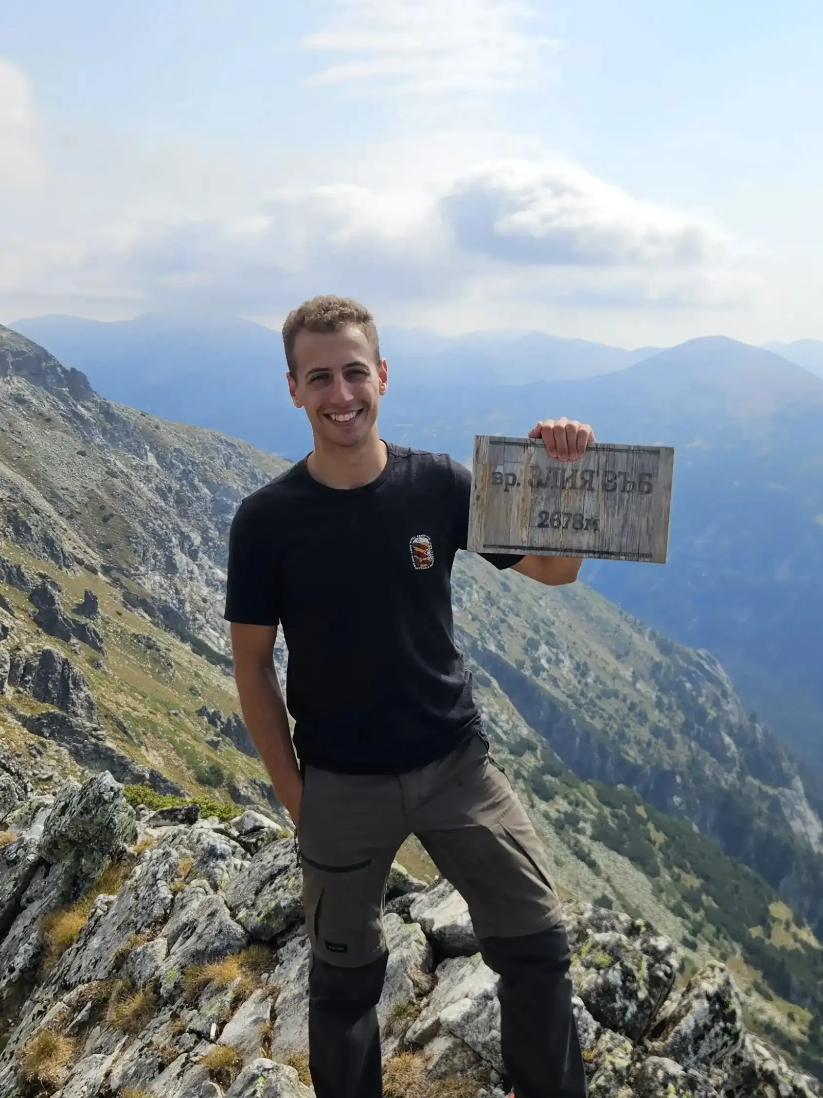 Holding the Zliya Zub summit sign